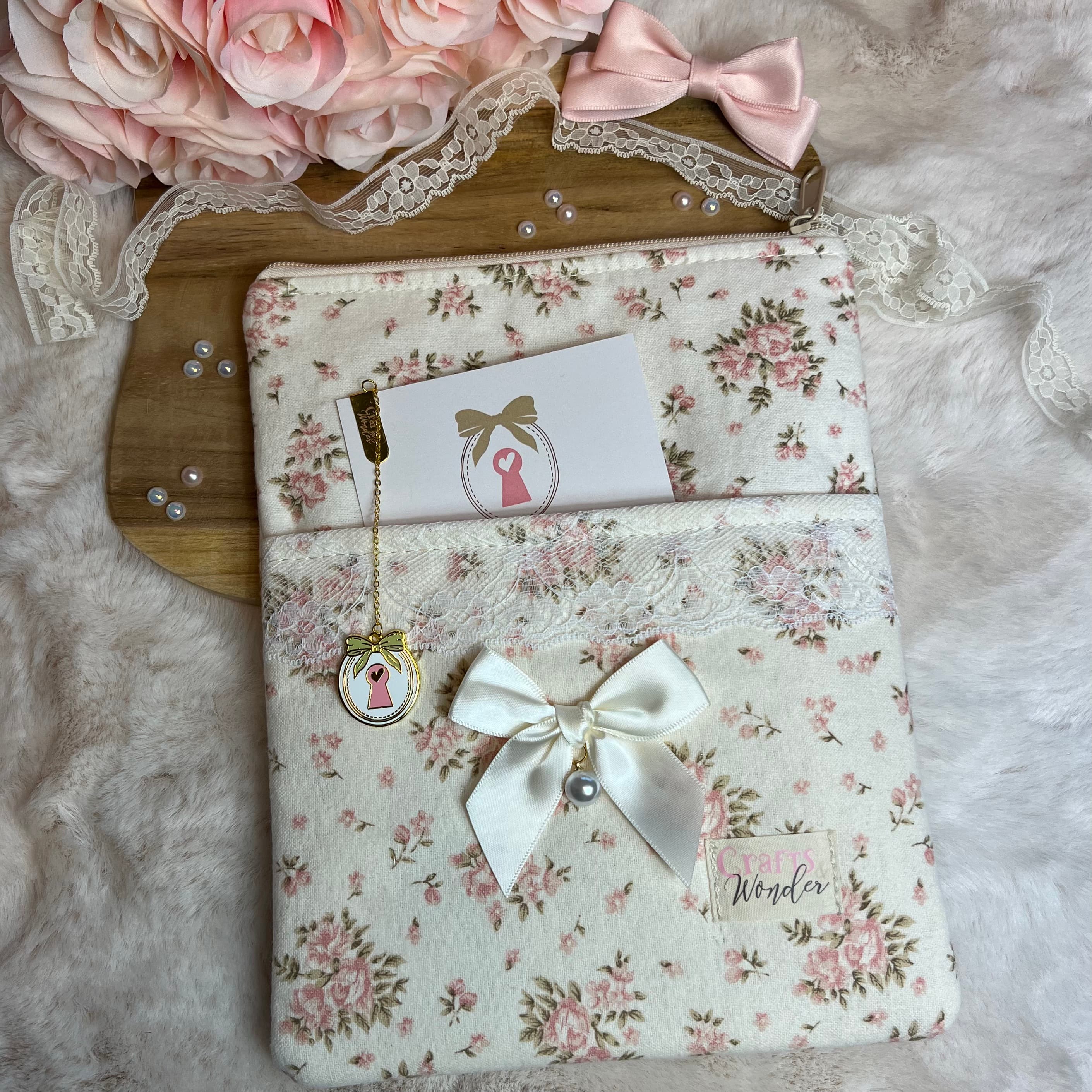 A vintage-style journal pouch with delicate lace details